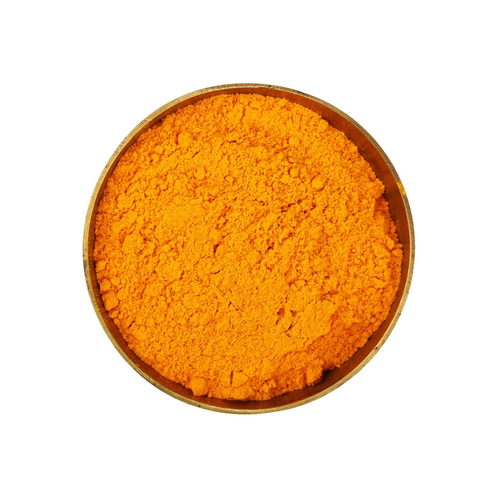 One bronze metal bowl full of yellow turmeric powder Turmeric Powder - Image 1